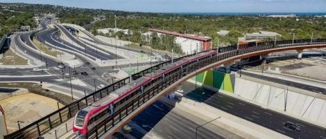 Image of the Flinders Link Railway Upgrade - a train travelling across a bridge over interconnecting roads