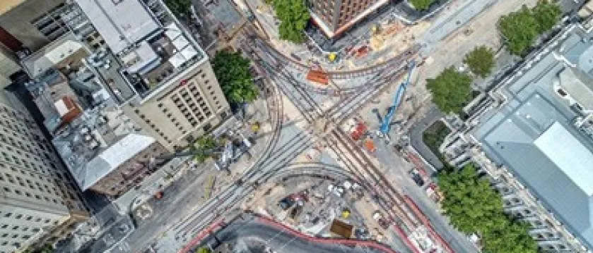 Birds eye view of a track junction at a cross road in an urban area